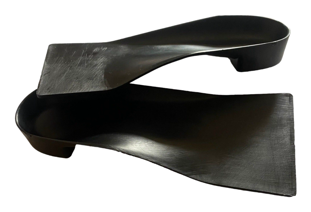 Sole Solution orthotic pair, side profile showing the heel cup and arch